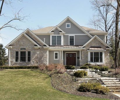 Luxury home with siding and stone facade - Big Easy Sidings