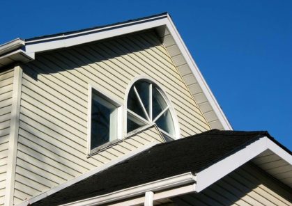 Fragment of a house on with bright blue sky