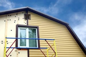 partially installed siding on a home