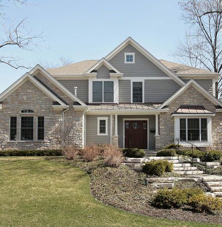 Luxury home with siding and stone facade - Big Easy Sidings