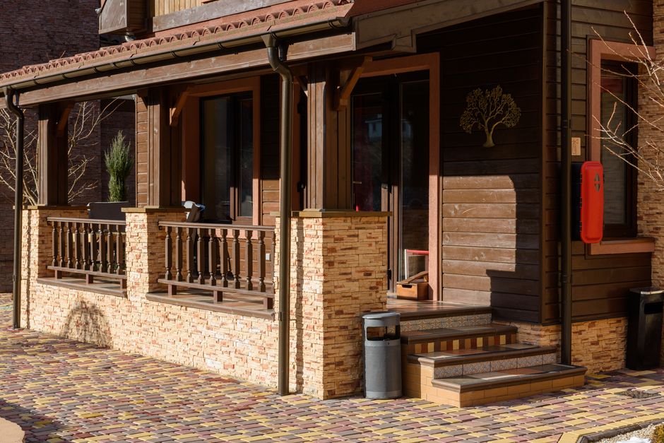 Wood siding repair showing restored panels on a home exterior