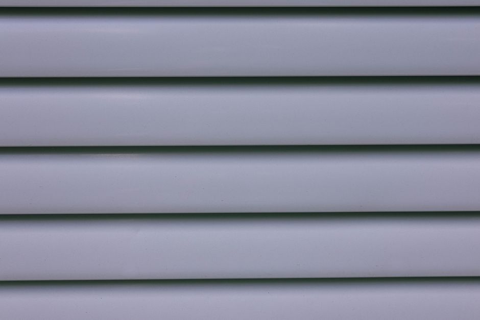 Close-up texture comparison of Dutch lap vinyl siding panel