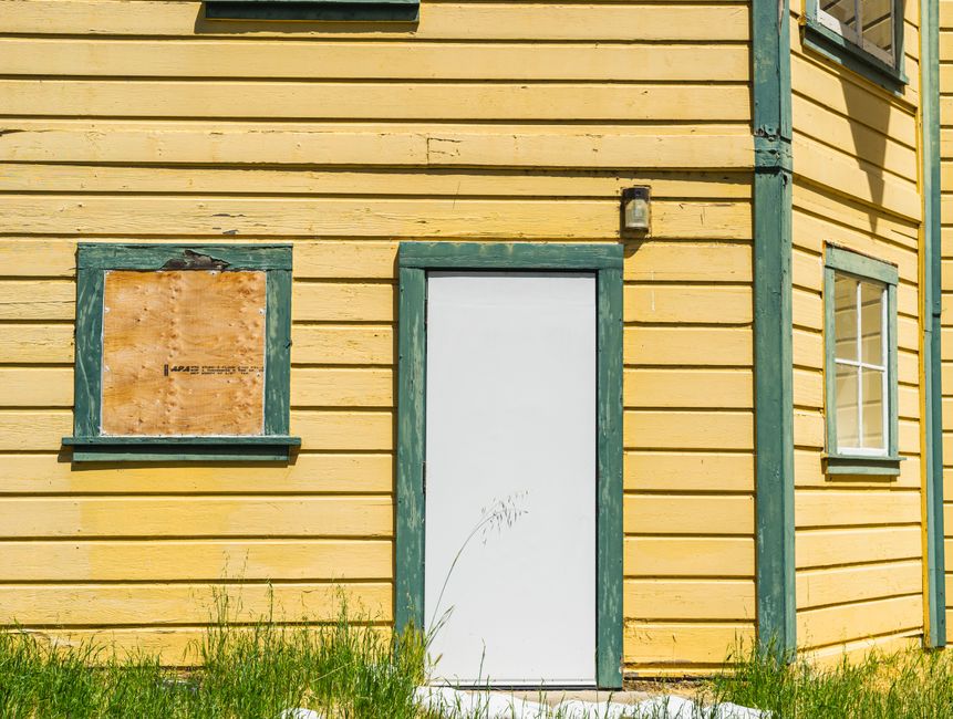 Vertical board and batten vinyl siding on a home exterior
